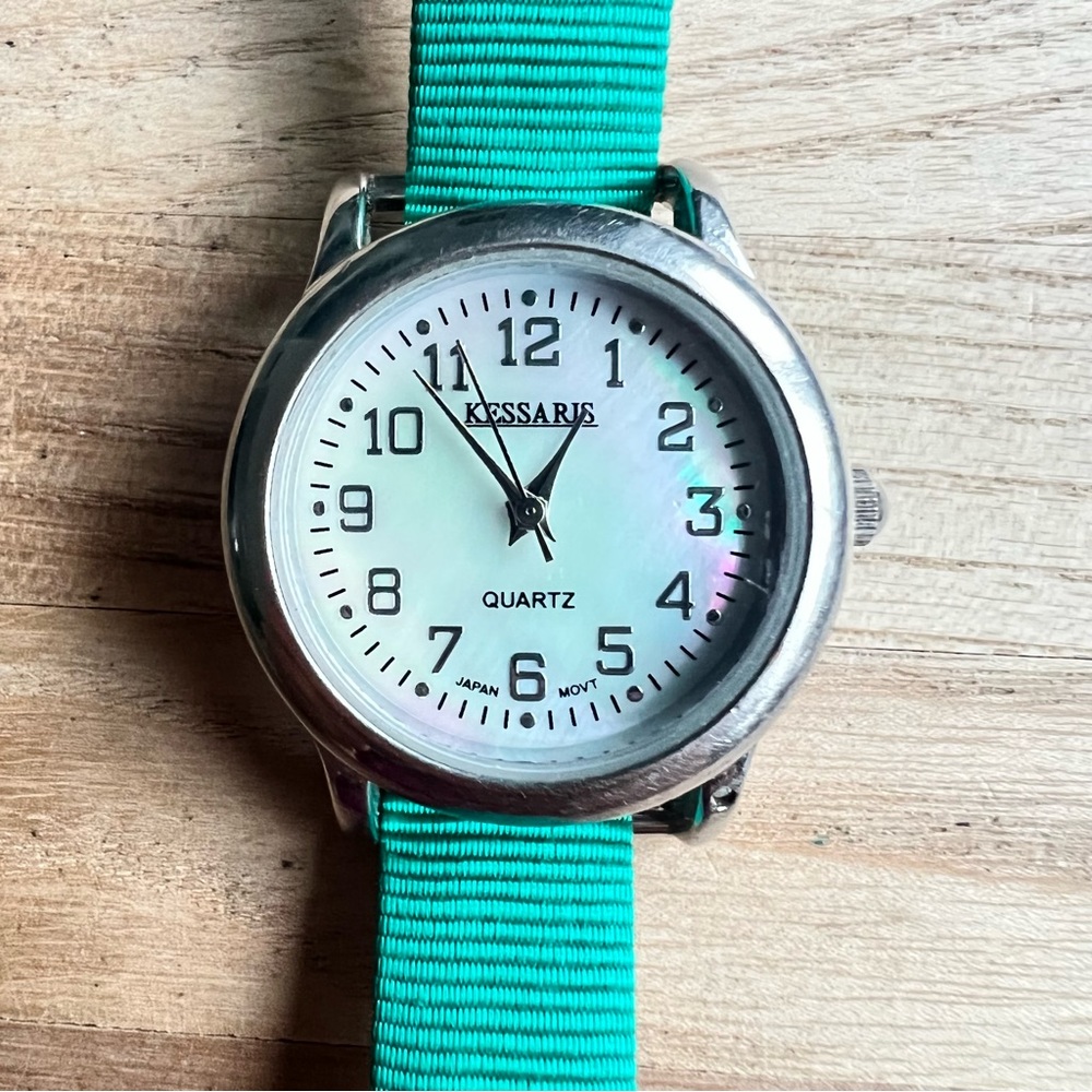 Kessaris ladies Mother of Pearl dial green strap fashion watch NEW BATTERY